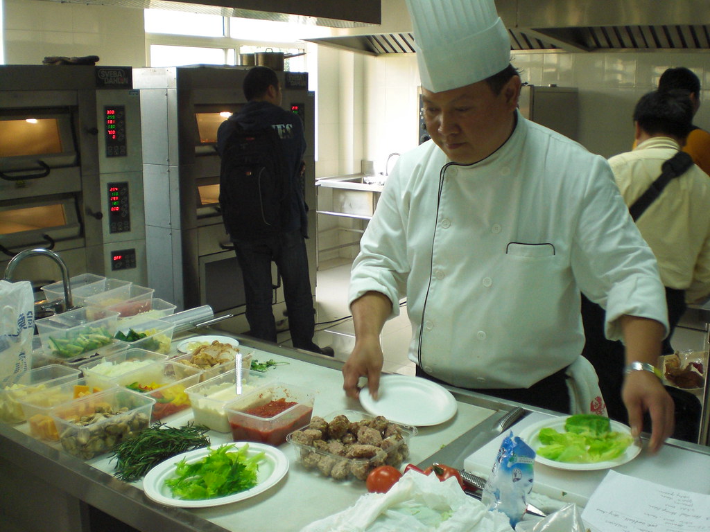 Professional pizza demonstration showing craft techniques
