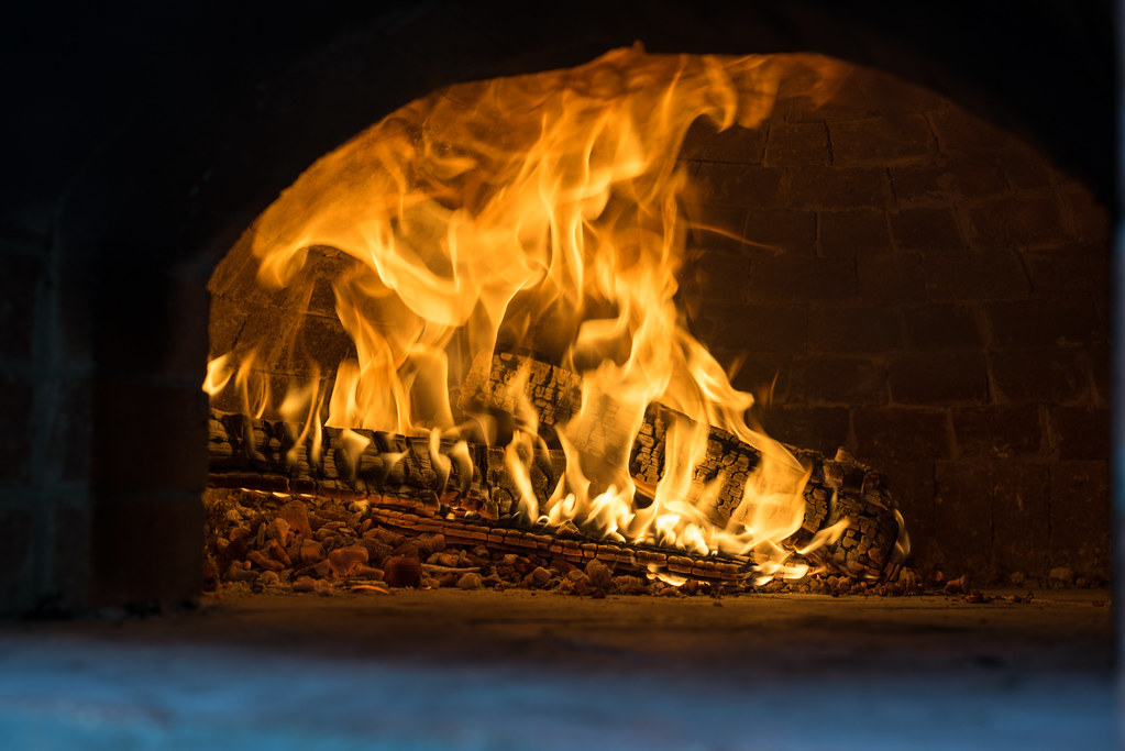 Wood-fired pizza oven demonstrating professional catering capabilities
